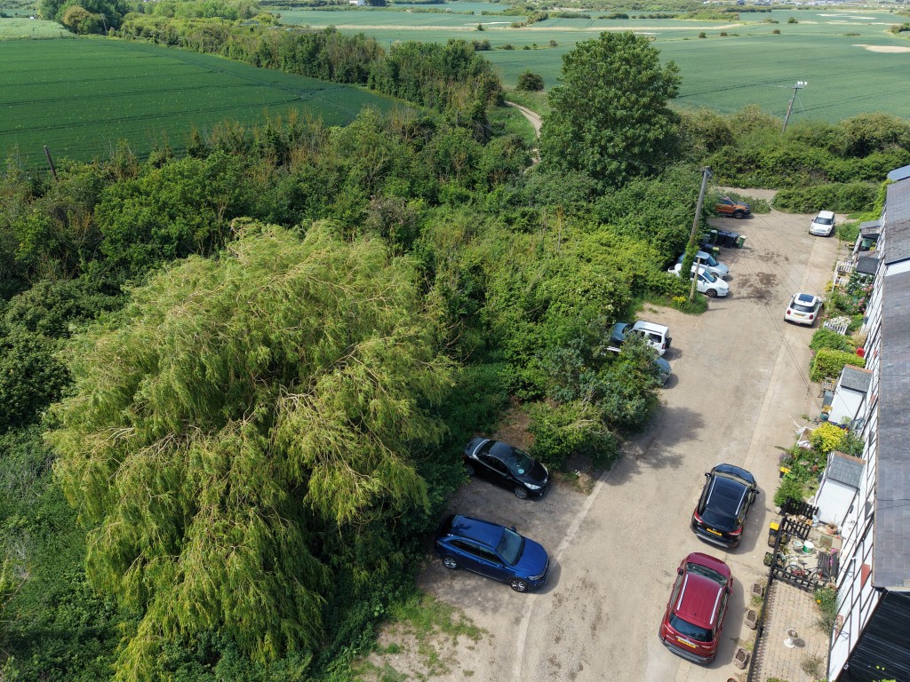 Lot: 12 - PARCEL OF LAND WITH POTENTIAL - Drone shot showing the road